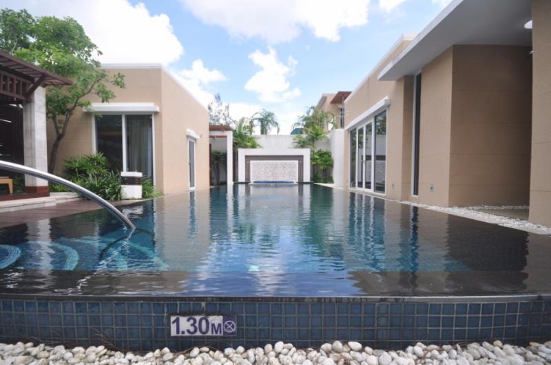  Picture Beach Front Pool Villa 3-bedroom for sale located in Mai Khao, Phuket.